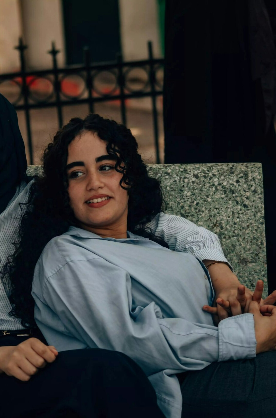 Portrait of a professional woman with curly hair smiling